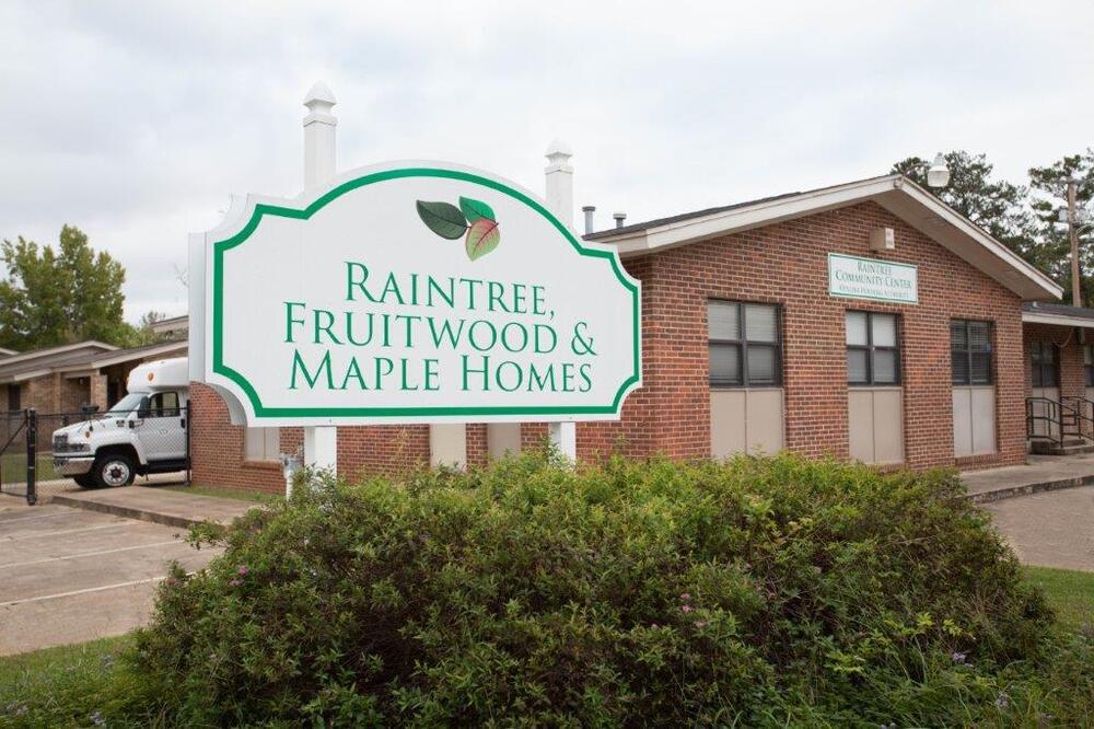 Sign that reads: Raintree, Fruitwood, & Maple Homes