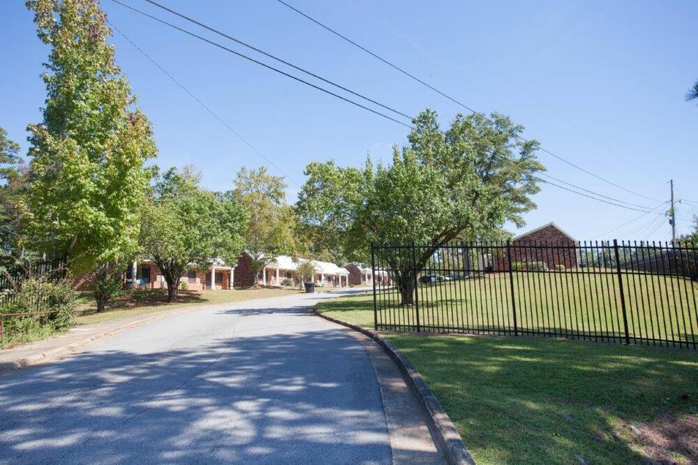 Tree lined street with homes