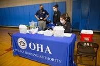 OHA Staff organizing paperwork and managing the event