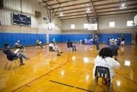 Residents spaced out waiting to receive their vaccine